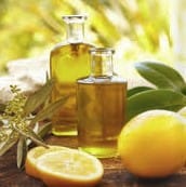 lemons and its essential oil in glass bottles front view.jpg www.gonaturey