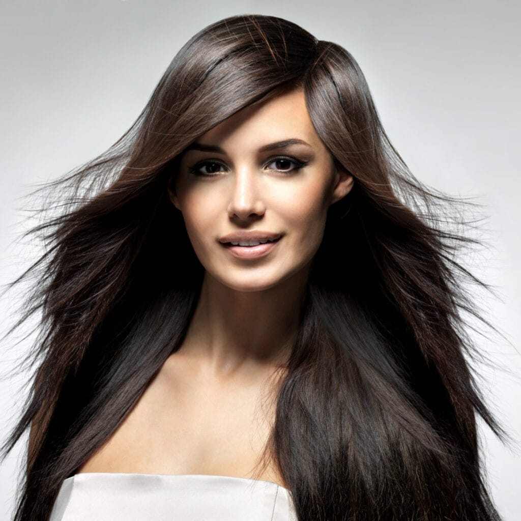 young lady showing her shiny long and healthy hair
