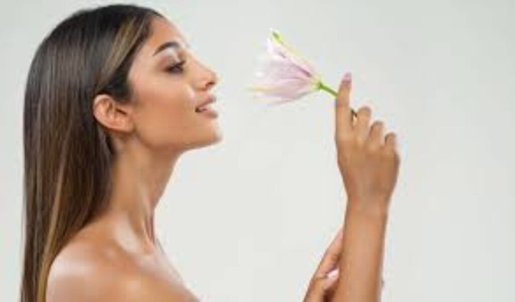 How to Determine Your Body Skin Type lady smelling a pink flower