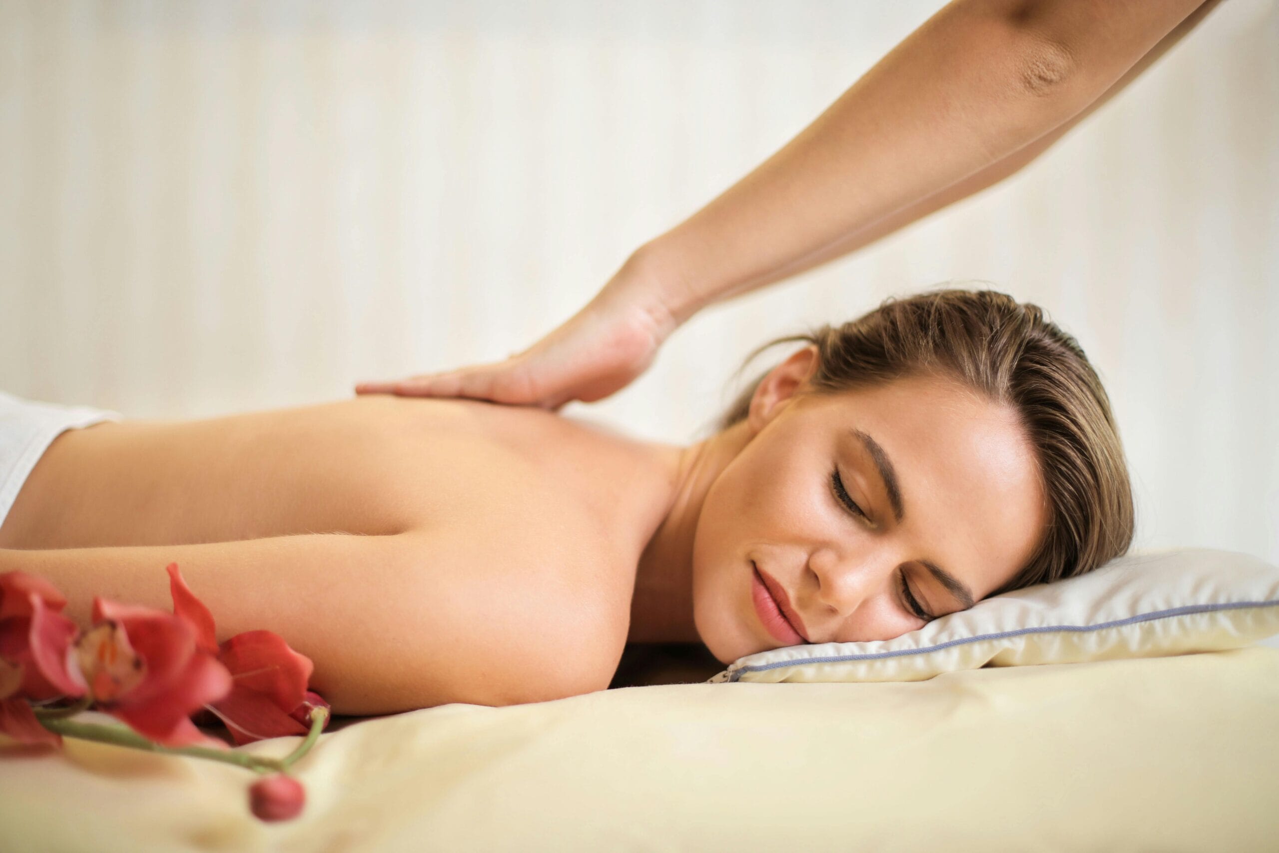 pexels photo 3757952 3757952 A serene spa scene featuring a woman receiving a therapeutic massage, surrounded by soothing elements.